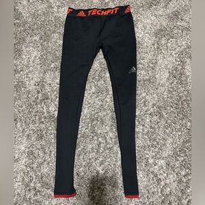 Adidas, red and black compressions, size medium in men’s